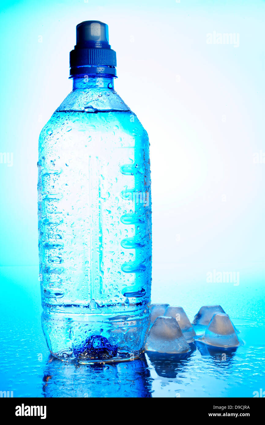 Bottle of mineral water with ice cube Stock Photo