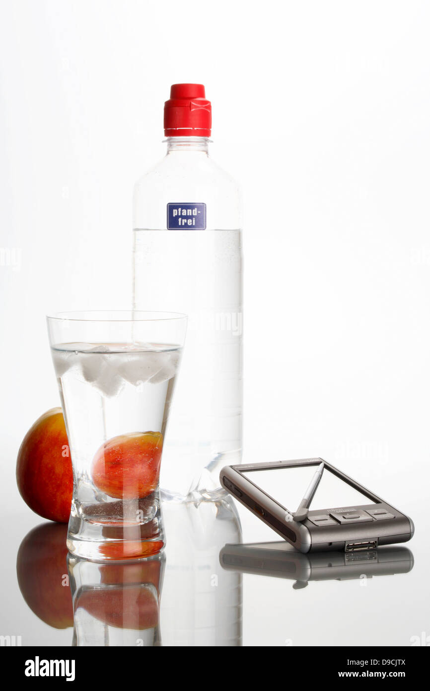 Mineral water, apple and PDA Stock Photo