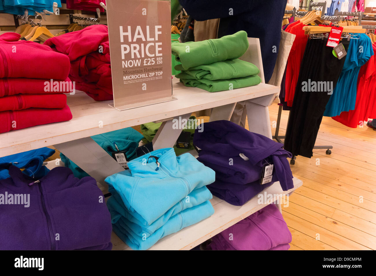 Half price clothing in a retail store Stock Photo - Alamy