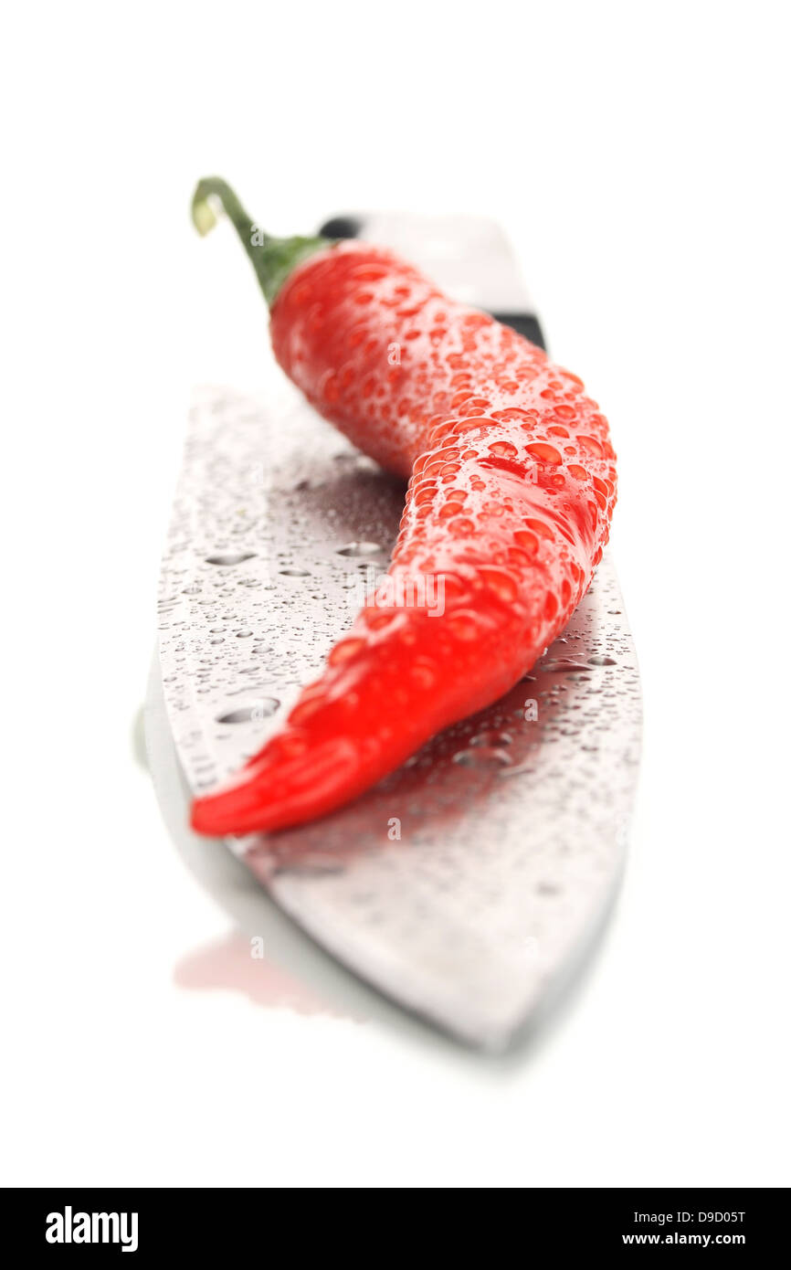 Culinary knife with a chilli, Kitchen knife with a red pepper Stock Photo