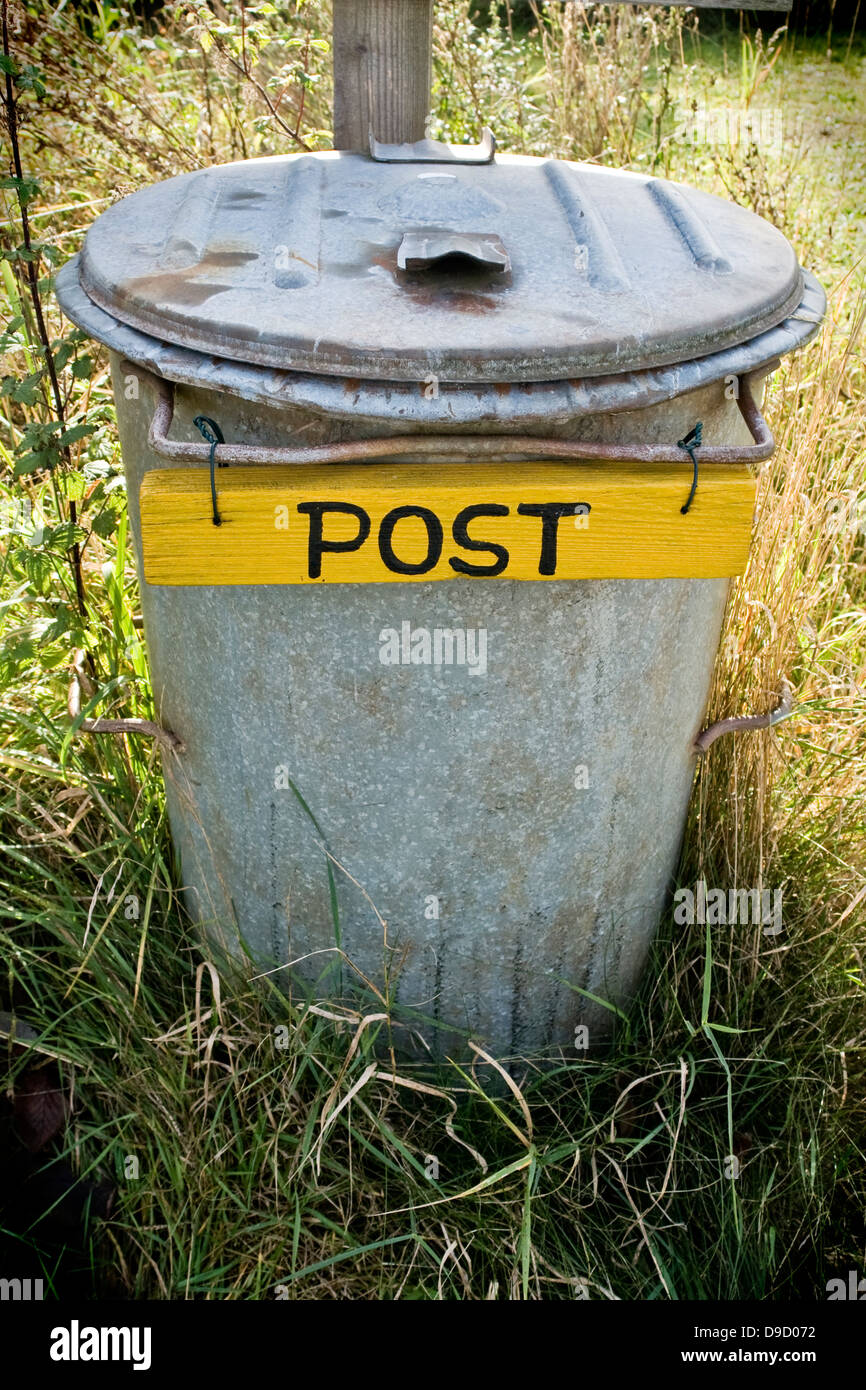 Old garbage tonne as a mailbox Old garbage ace a mail box Stock Photo
