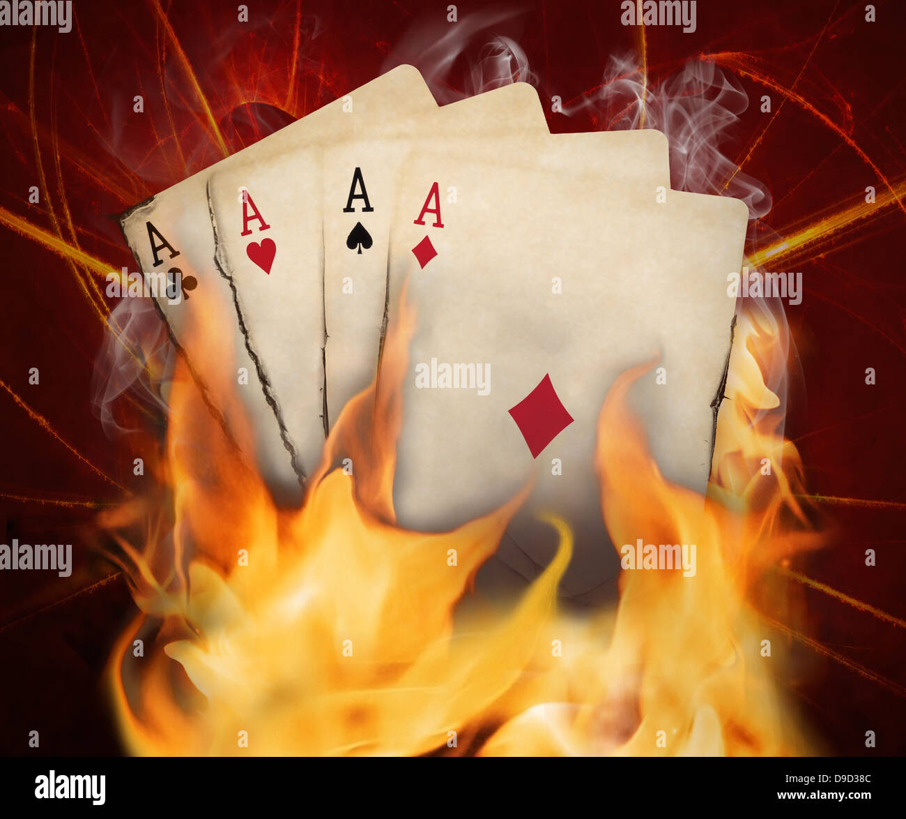 Poker cards burn in the fire. Stock Photo
