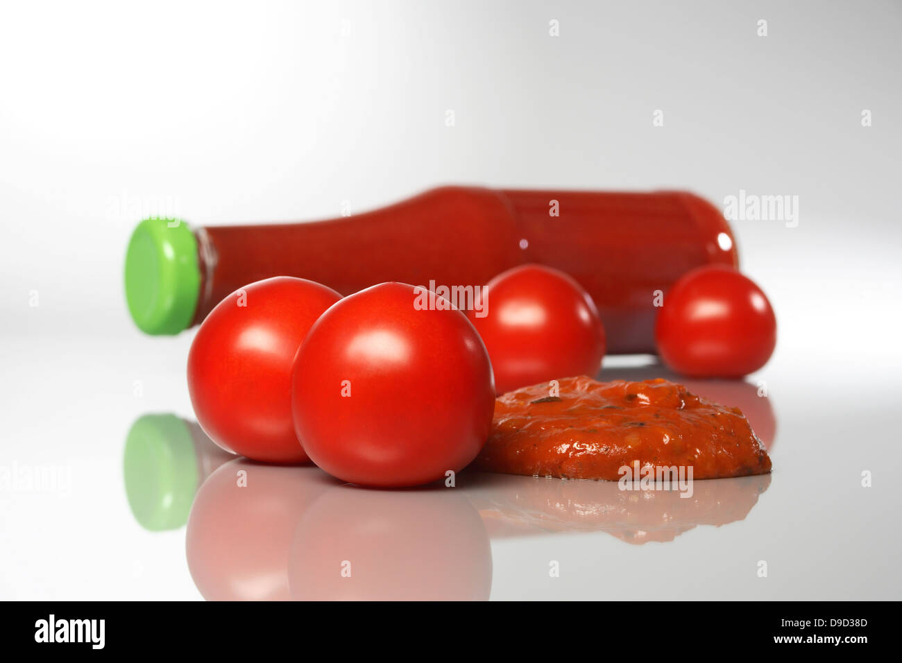Tomatoes and ketchup Stock Photo