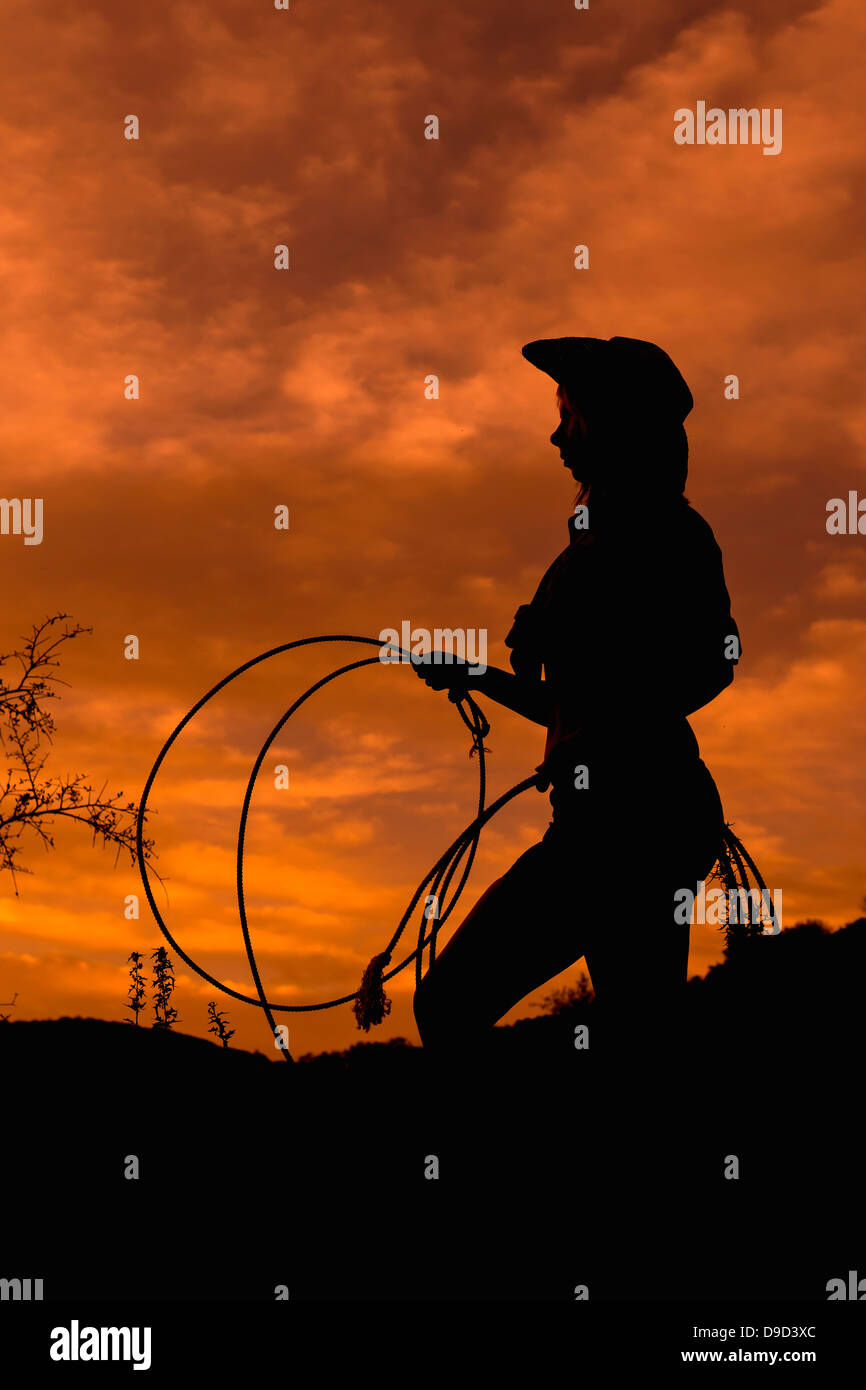 USA, Texas, Silhouette of young woman standing at sunset Stock Photo