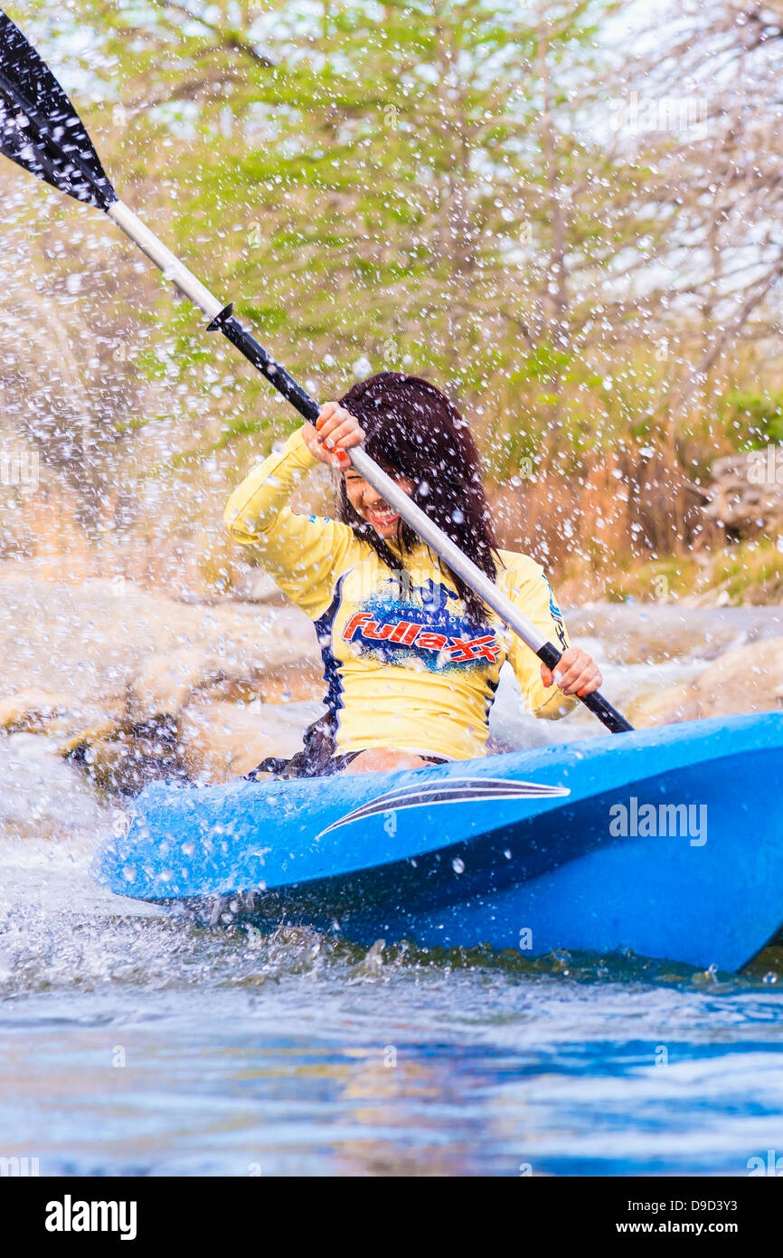 USA, Texas, Young woman kayaking on Frio River, smiling Stock Photo Alamy