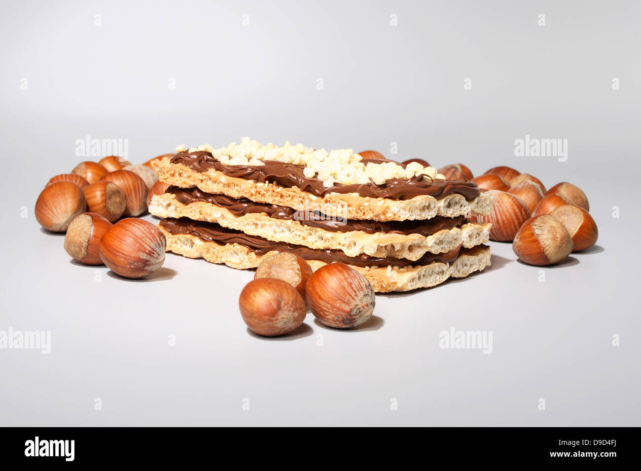 Nut nougat cuts with hazelnuts Stock Photo