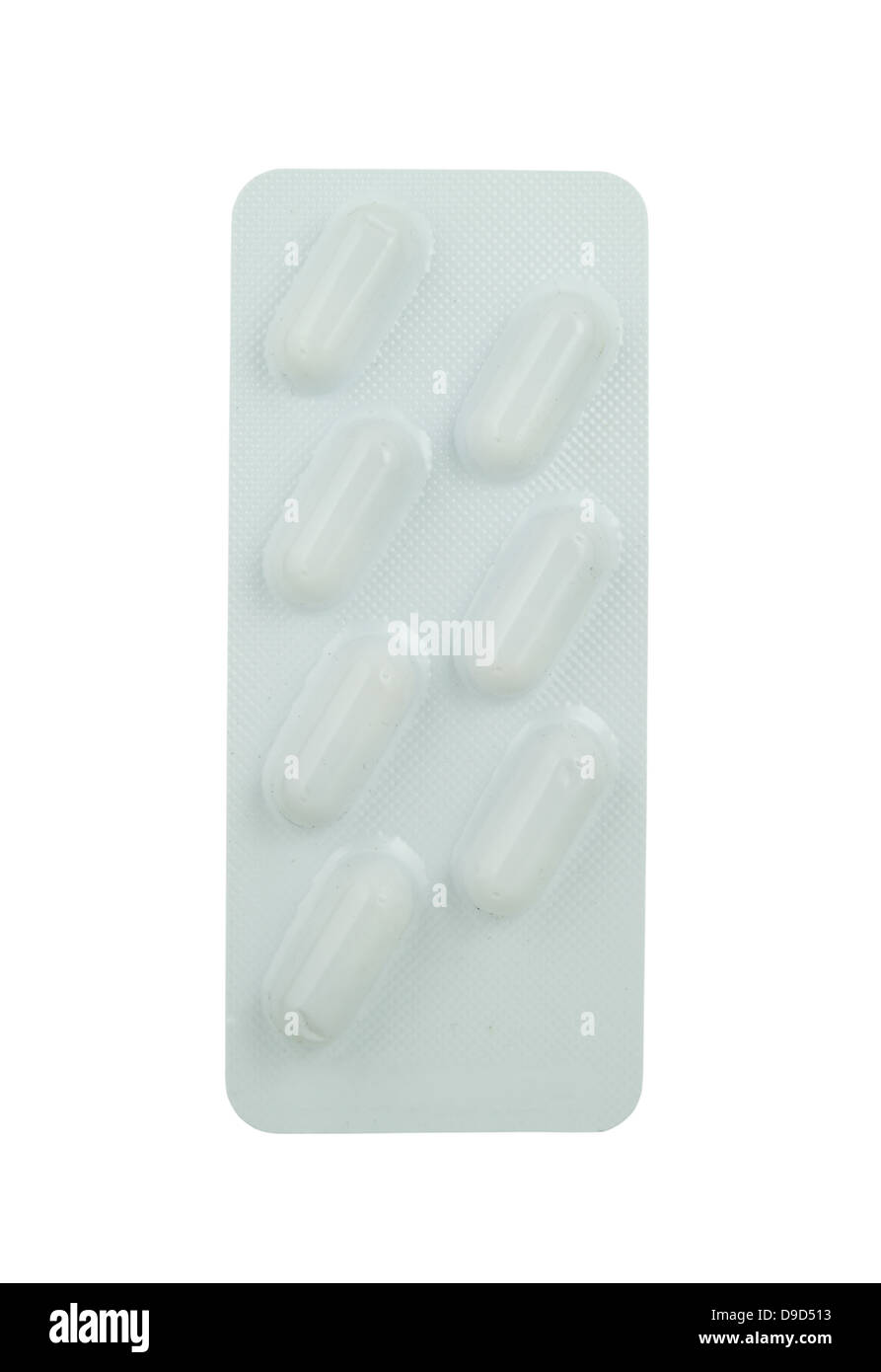 Capsules packed in blister on white background Stock Photo - Alamy