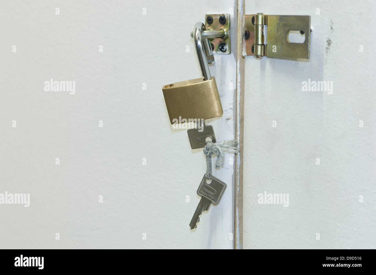 Germany, Door lock opened with key Stock Photo Alamy