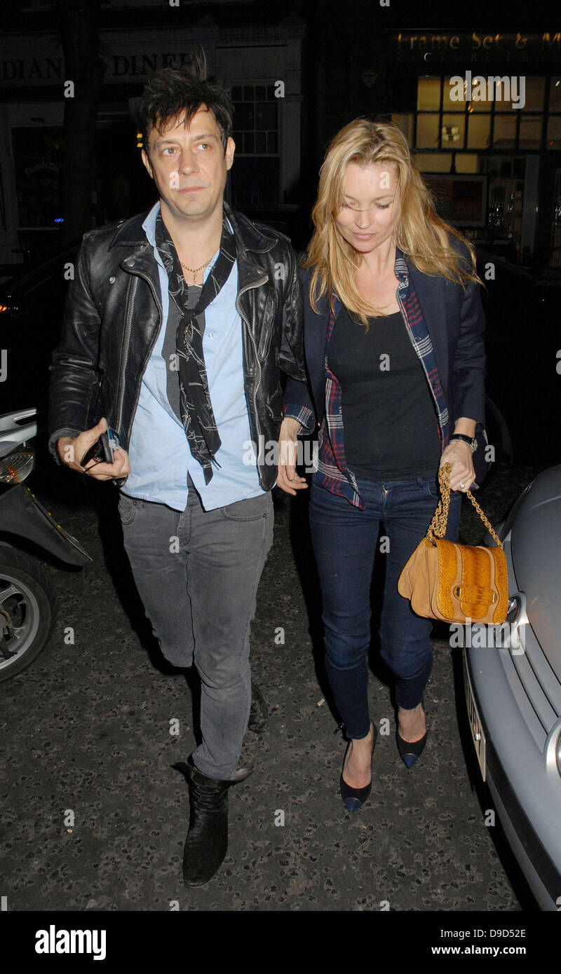 Jamie Hince and Kate Moss outside The Hospital Club where Hince's band 'The Kills' performed tracks from their new album 'Blood Pressures' London, England - 24.03.11 Stock Photo