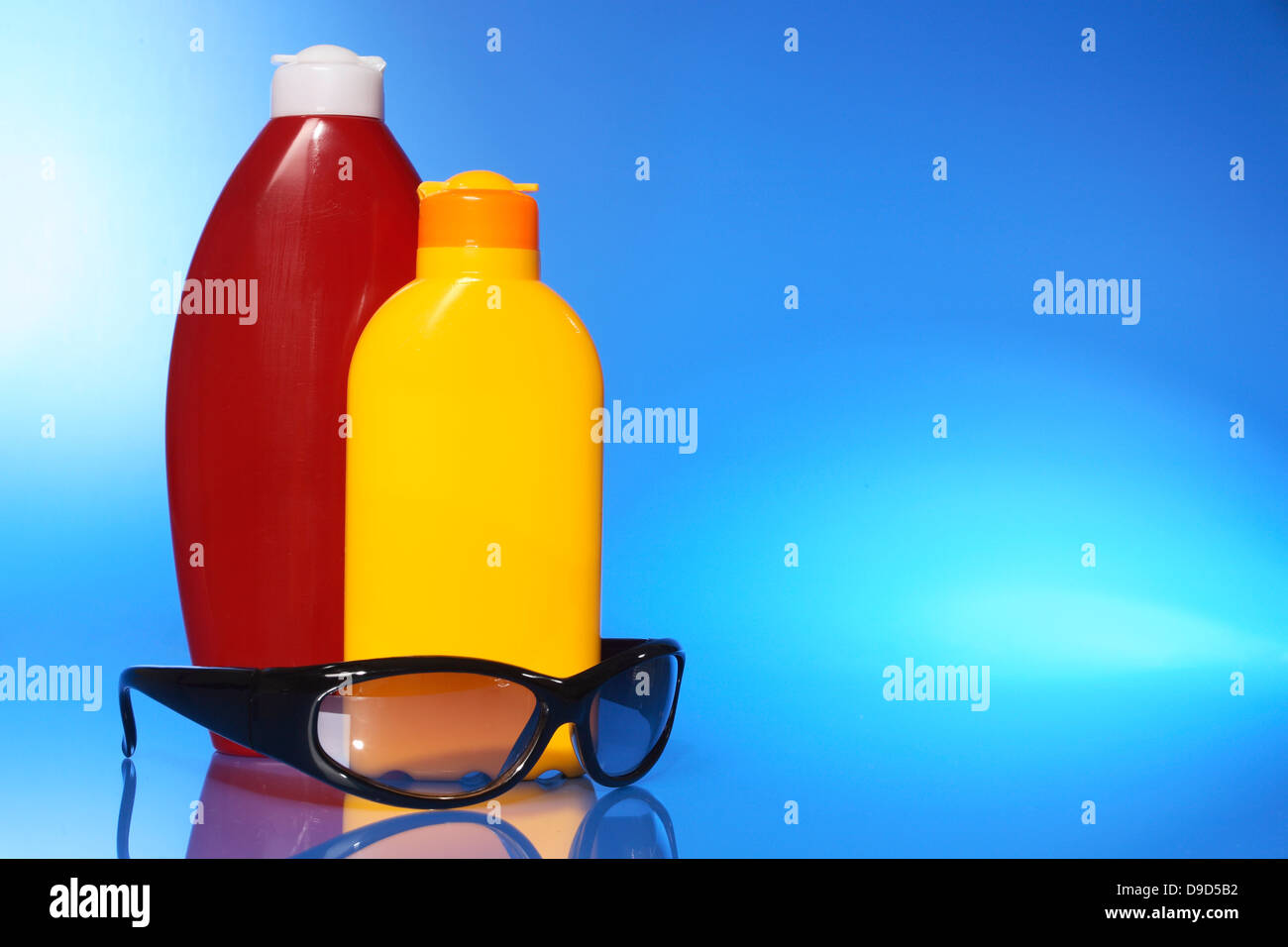 Solar milk, lotion and sunglasses Stock Photo
