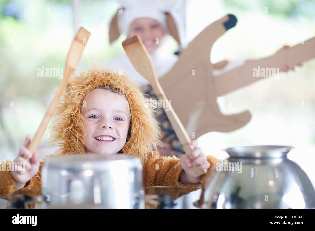 Children pretending to play music instruments Stock Photo