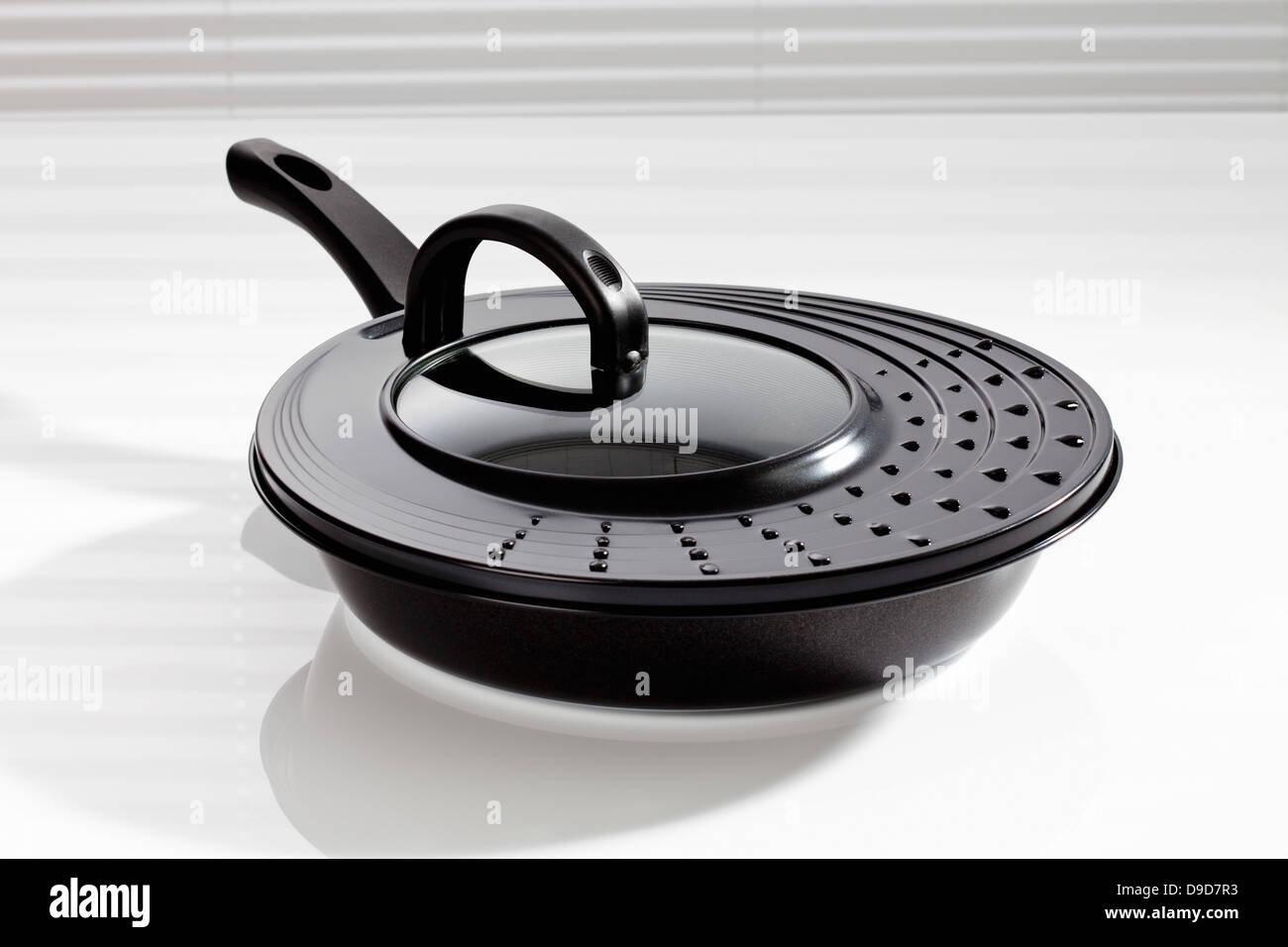 Frying pan with lid on white background, close up Stock Photo