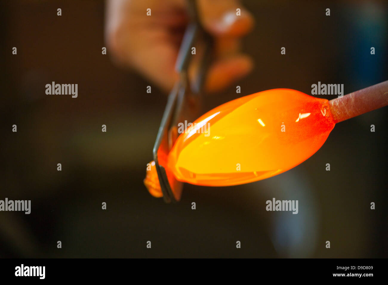 Person cutting glass with hand tool Stock Photo Alamy