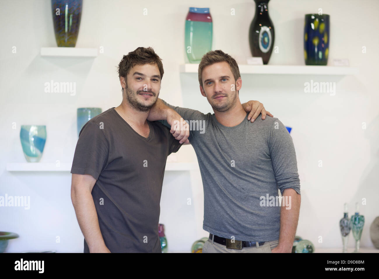 Men with arms around each other hi-res stock photography and images - Alamy