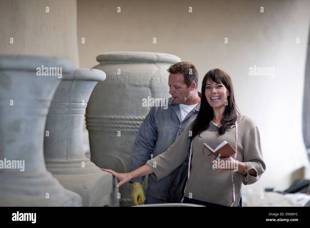 Dealing with sales in pottery factory Stock Photo