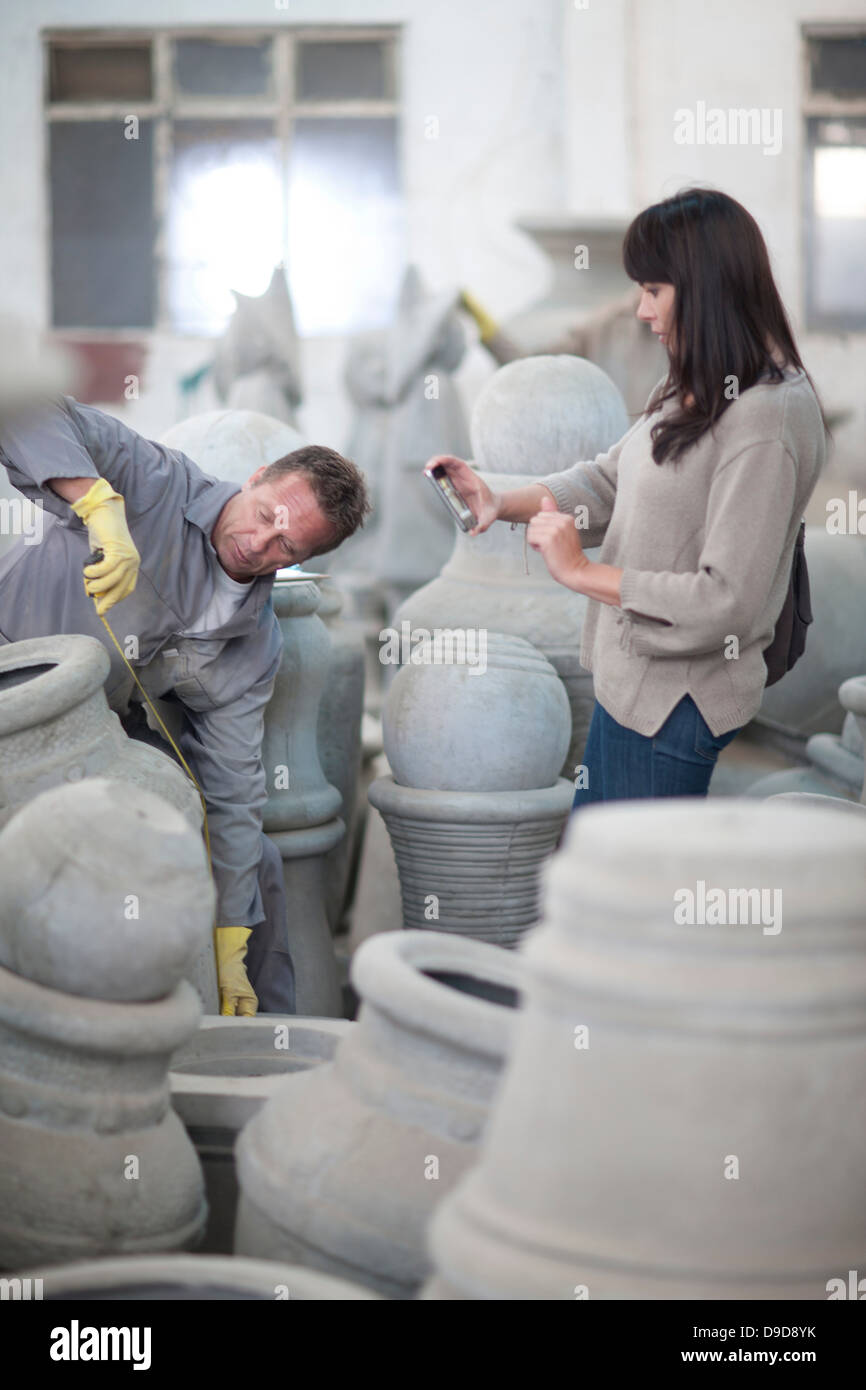 Dealing with sales in pottery factory Stock Photo Alamy