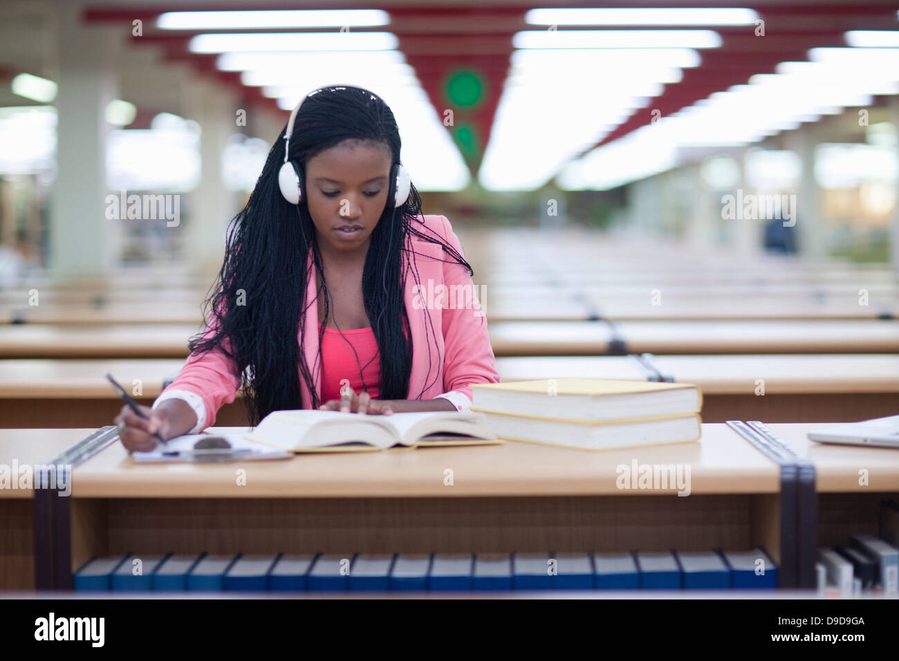 Female student studying in library Stock Photo