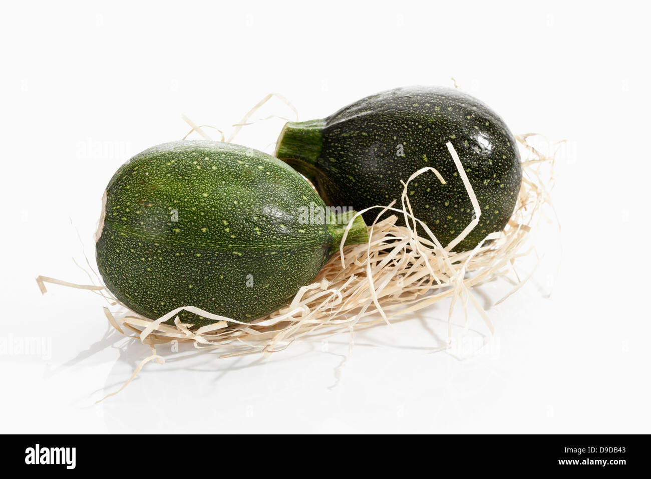 Courgettes on white background, close up Stock Photo - Alamy