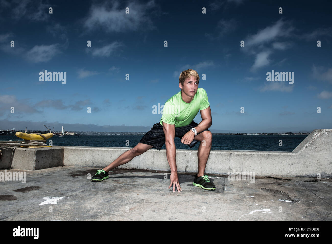 Young man warming up before exercise Stock Photo