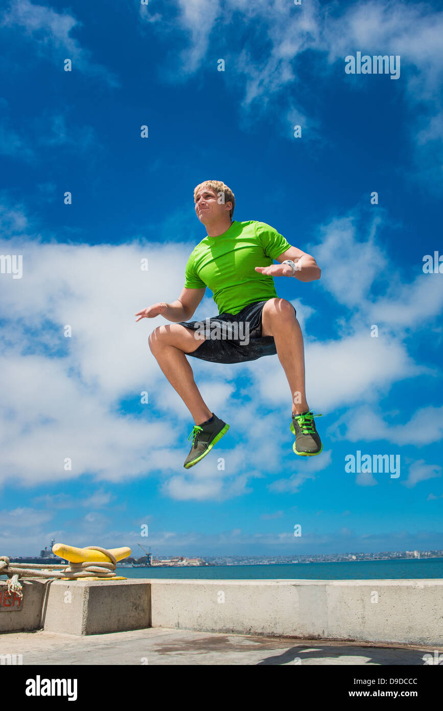 Young man jumping while fitness training Stock Photo