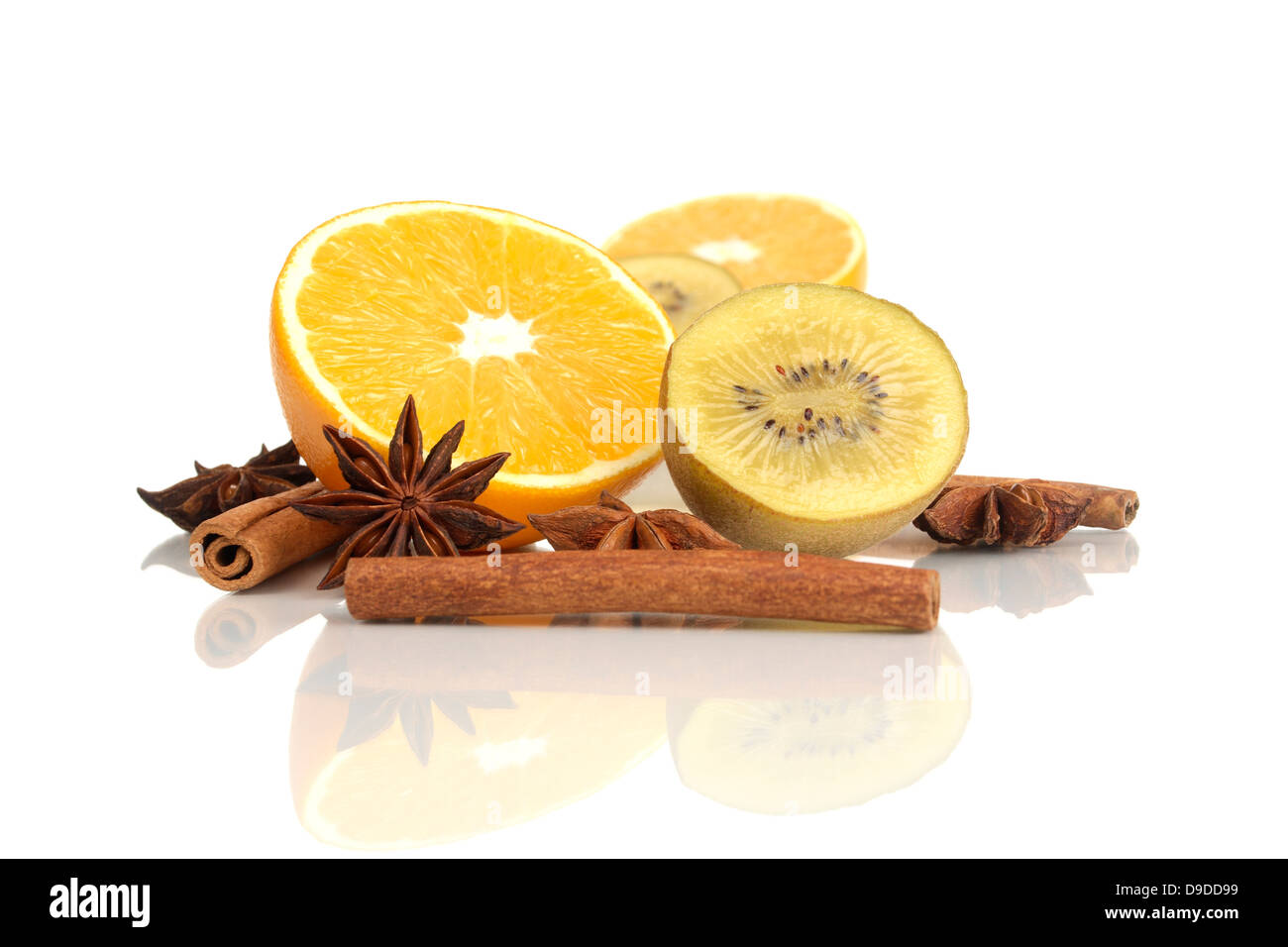 Orange, kiwi, cinnamon sticks and aniseed stars Stock Photo