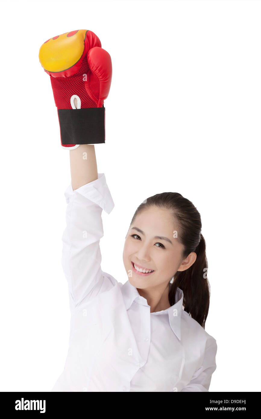 Business woman wearing boxing gloves Stock Photo