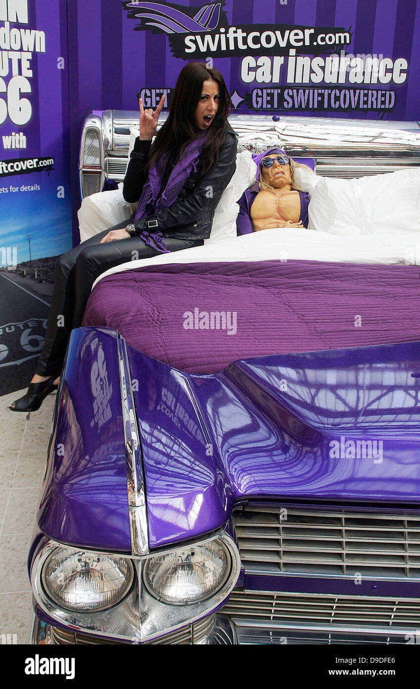A model poses with an Iggy Pop puppet for the promotion of swiftcover.com  car insurance in London London, England - 28.03.11 Stock Photo - Alamy
