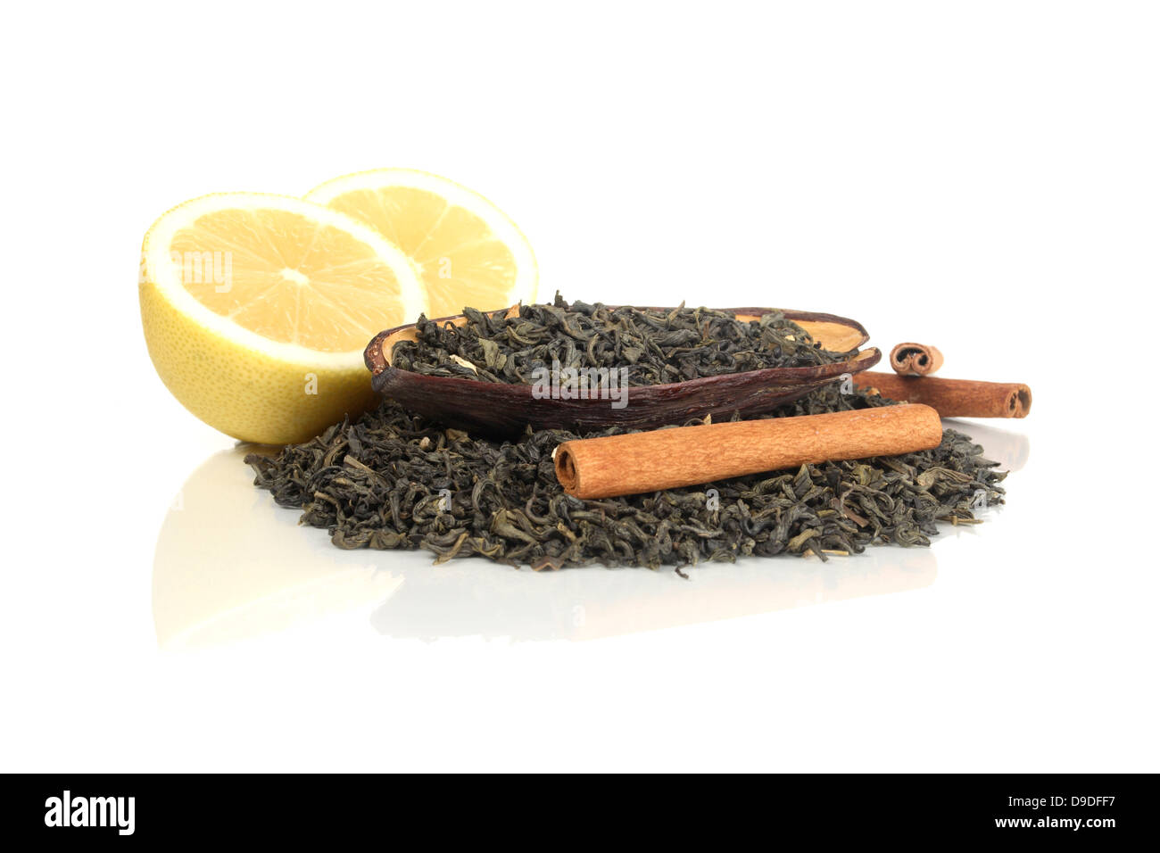 Tea mixture with lemon and cinnamon sticks Stock Photo