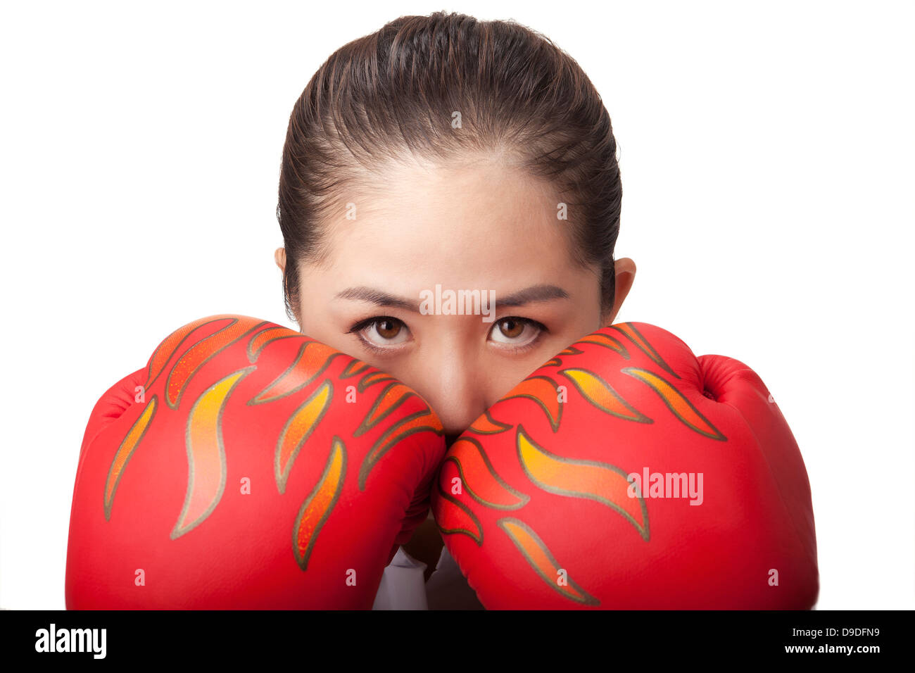 Business woman wearing boxing gloves Stock Photo