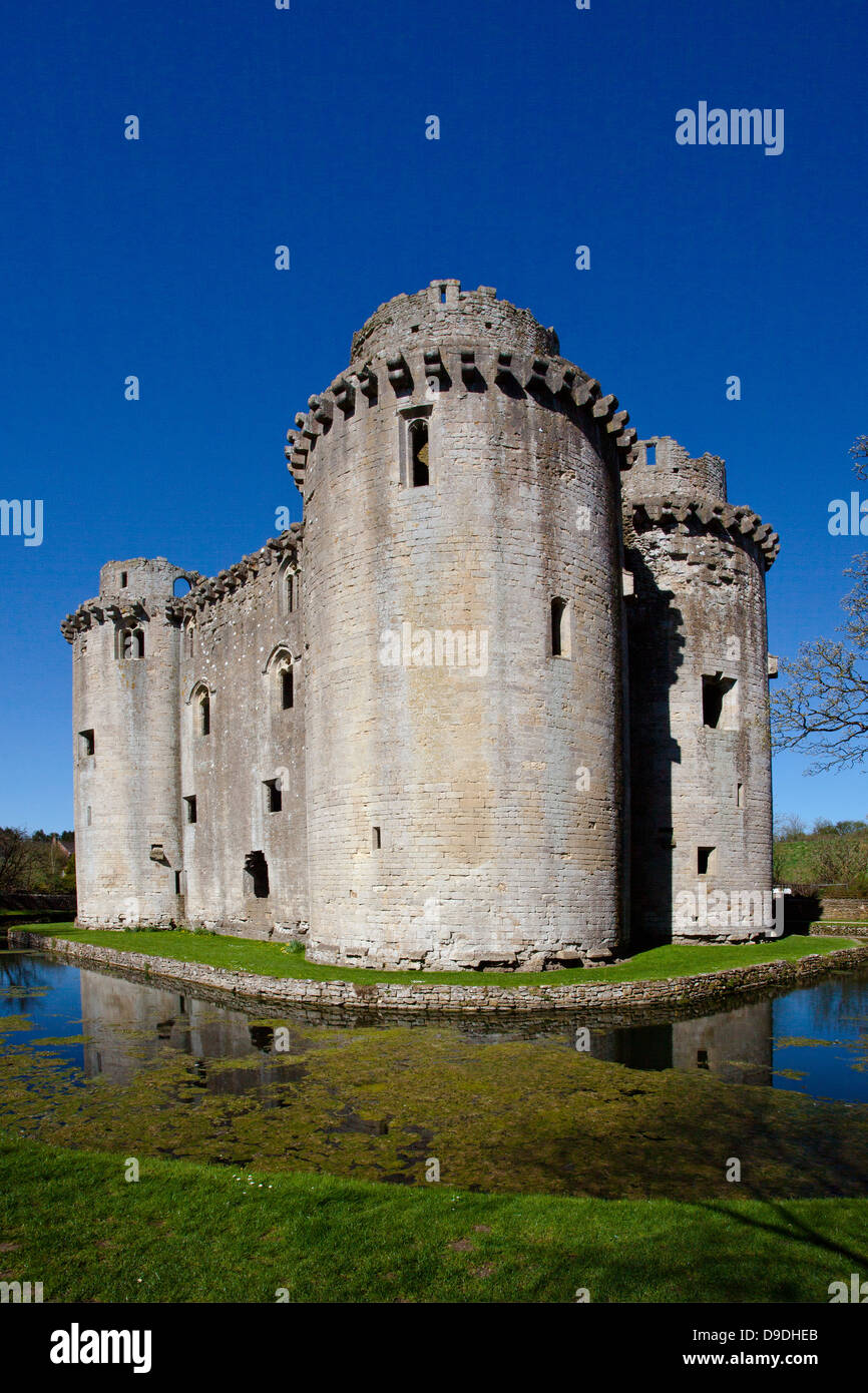 The ruins of Nunney Castle surrounded by its moat, built in the 1370s, near Frome, Somerset, England, UK Stock Photo
