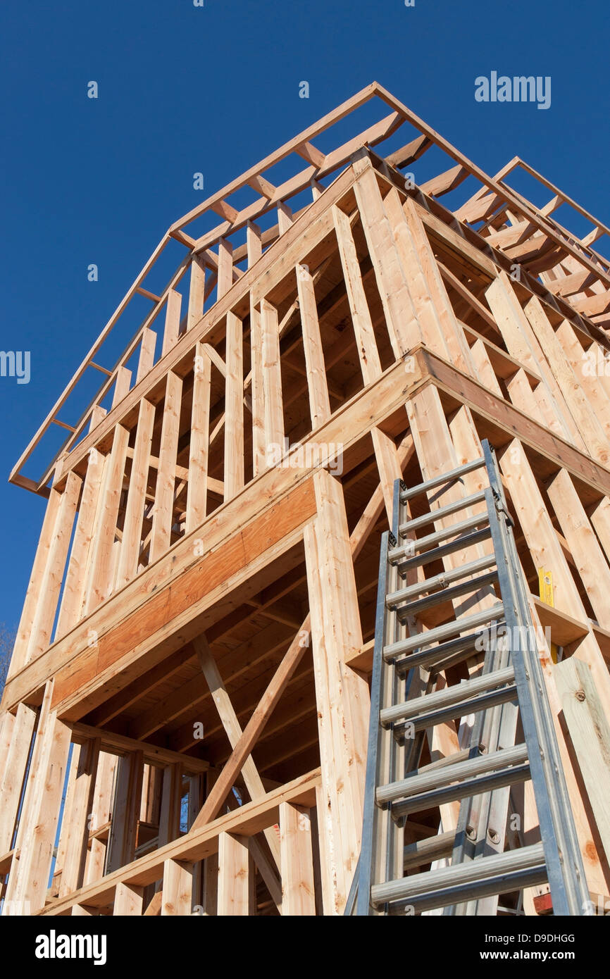 Wooden construction frame against blue sky Stock Photo