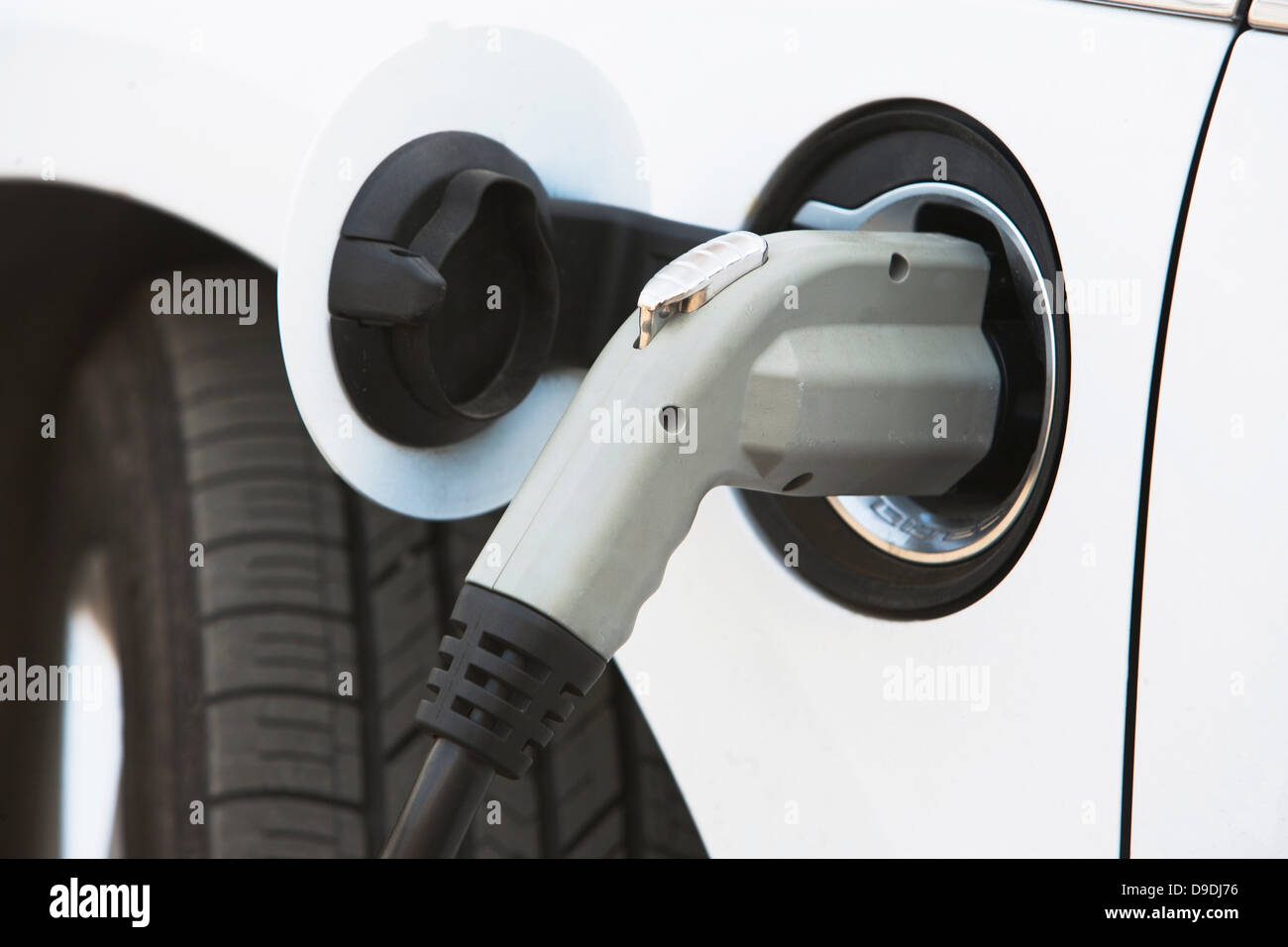 Close up of gasoline nozzle filling car tank Stock Photo