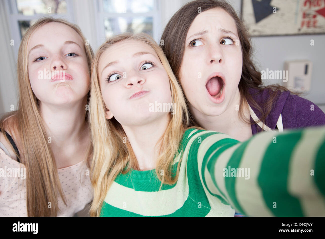 Teenagers pulling funny faces Stock Photo