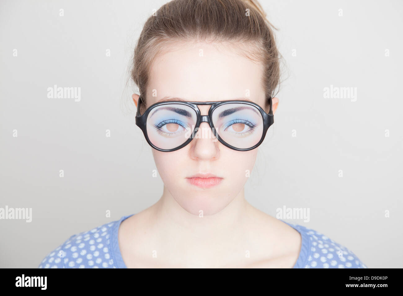 Girl wearing fake glasses Stock Photo