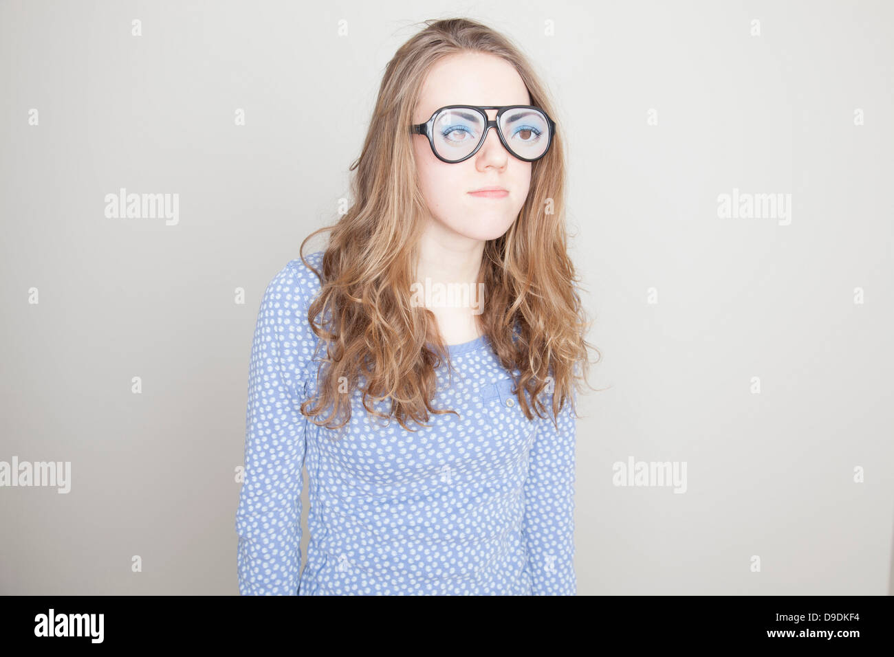 Girl wearing fake glasses Stock Photo