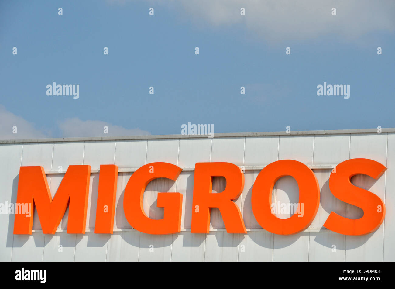 Migros supermarket sign/logo, Dreispitz, Basel, Switzerland Stock Photo
