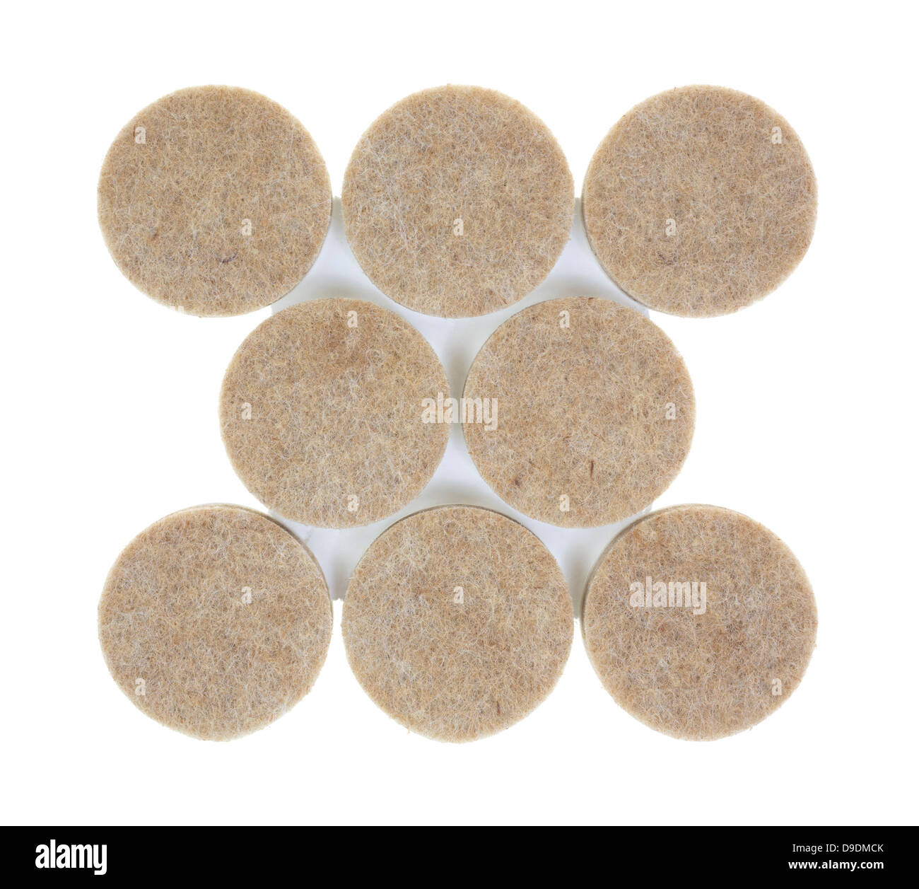 A group of new felt surface protectors on a white background. Stock Photo