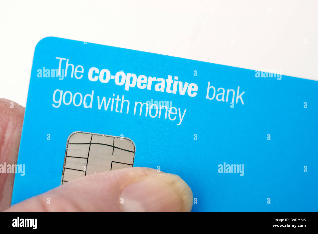 Woman holding a Co-operative bank debit card  Co-operative bank faces nationalisation Stock Photo
