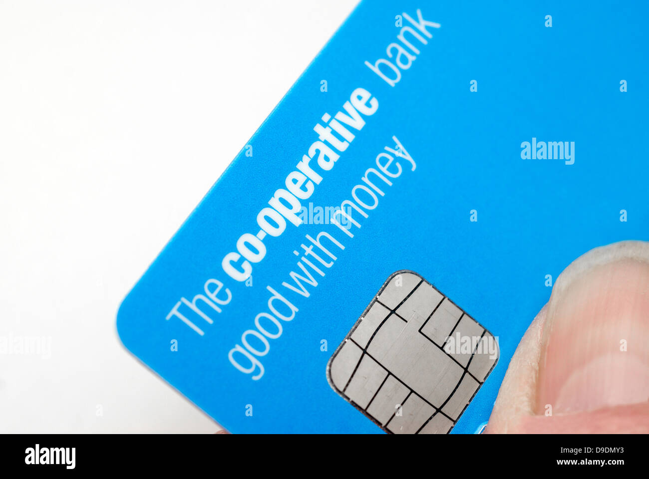 Woman holding a Co-operative bank debit card  Co-operative bank faces nationalisation Stock Photo