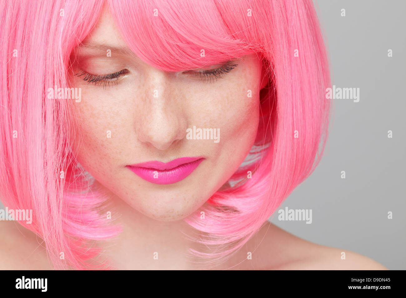 Close up of teenage girl with pink hair Stock Photo