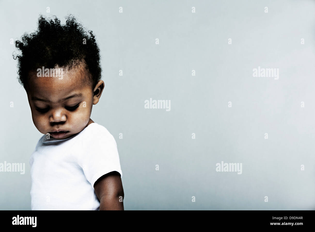 Portrait baby boy wearing white vest hi res stock photography and