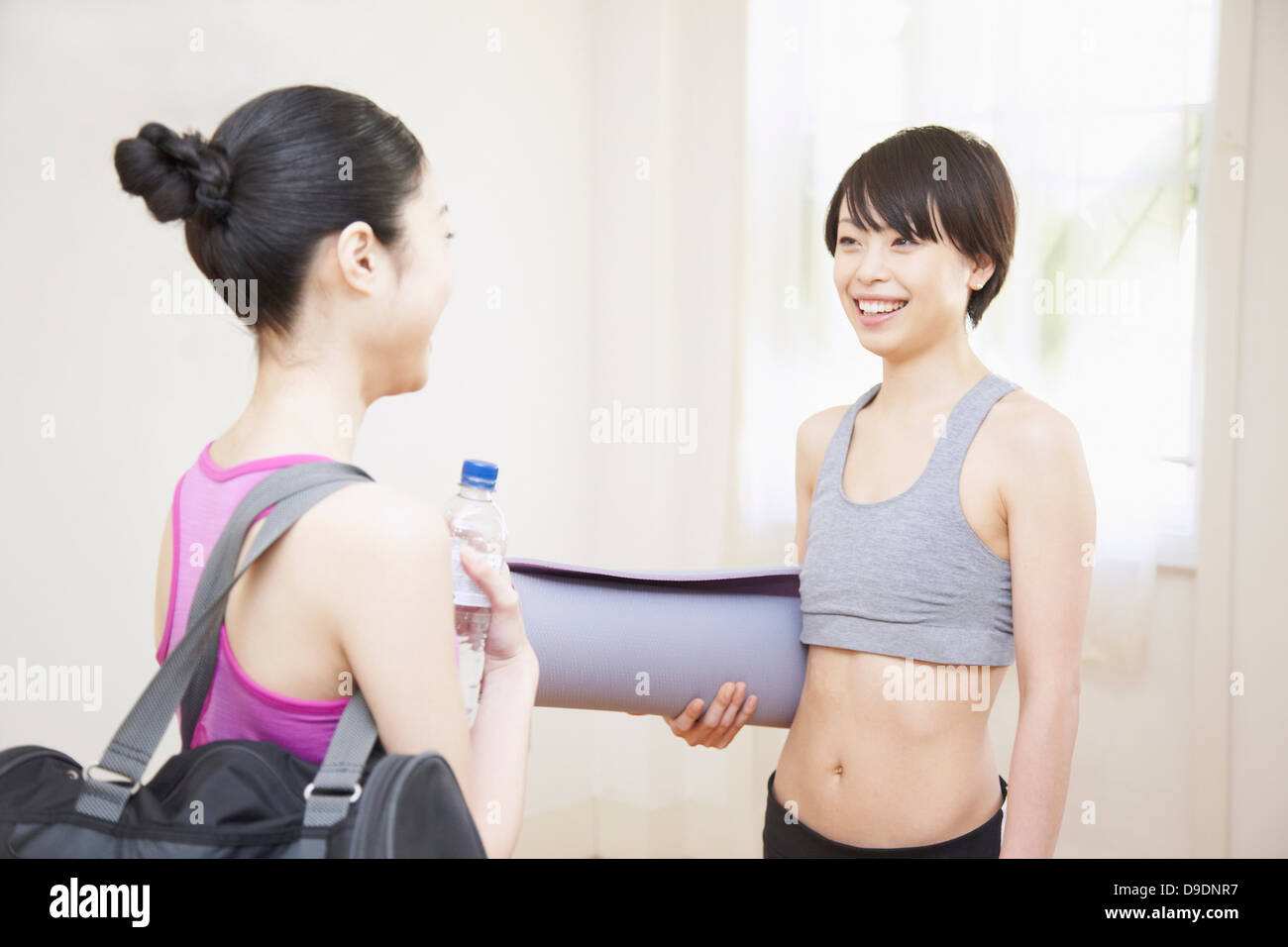 Women talking in gym Stock Photo