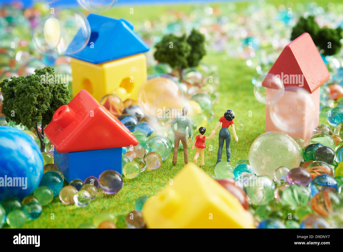 Figurines and houses made from plastic blocks with marbles Stock Photo