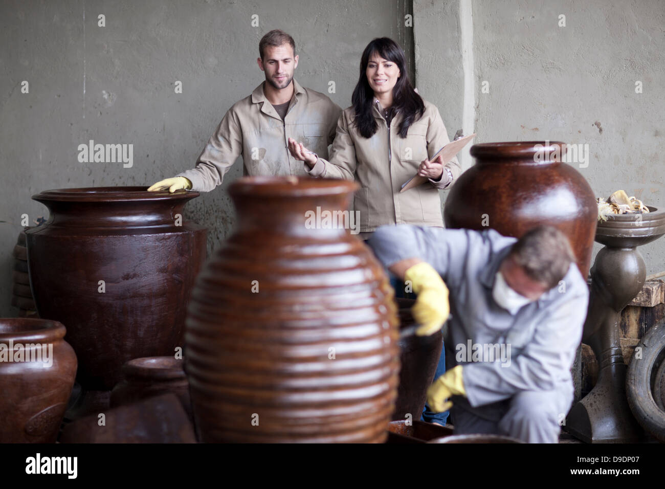 Painting and staining process in pottery factory Stock Photo Alamy
