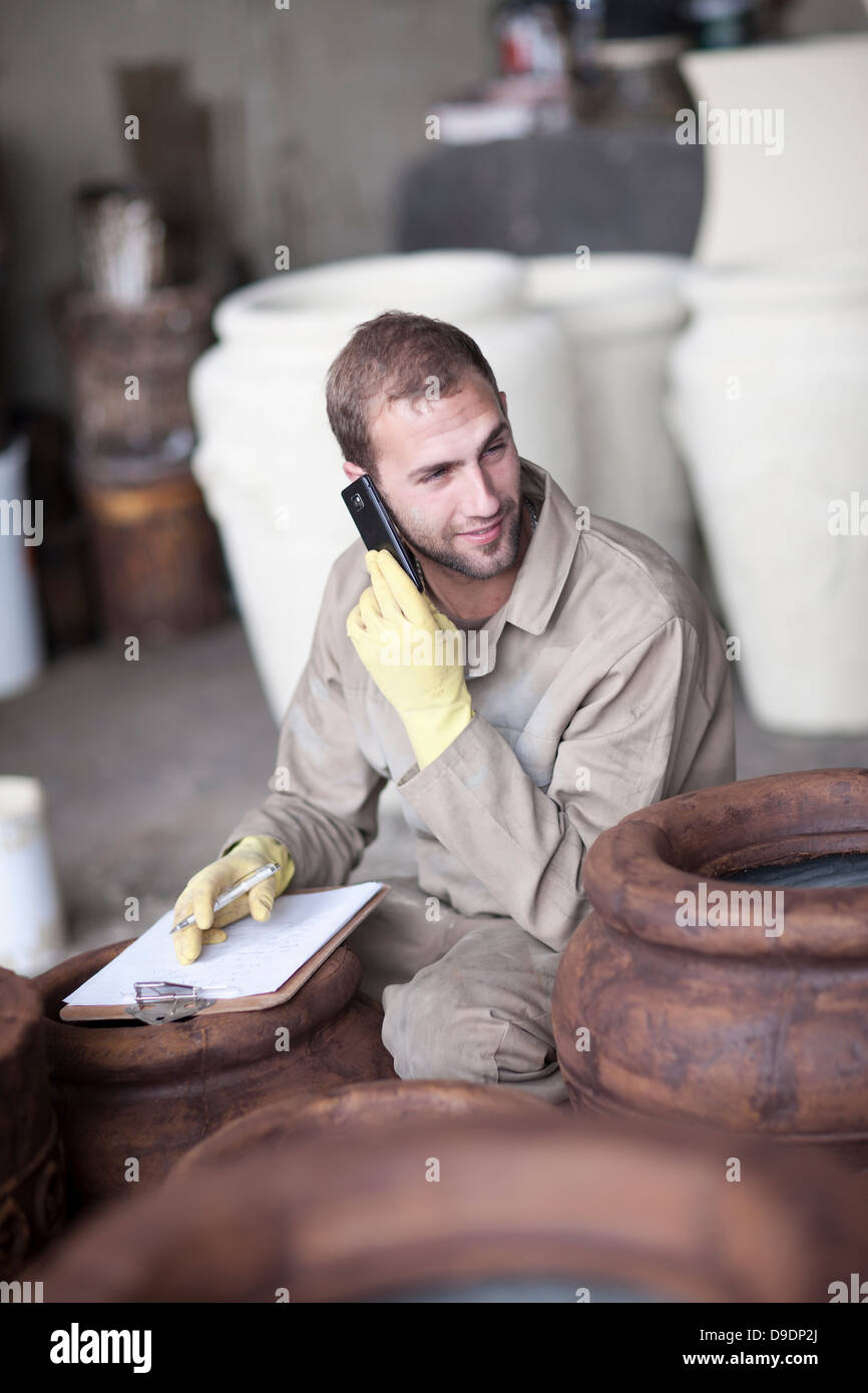 Painting and staining process in pottery factory Stock Photo Alamy