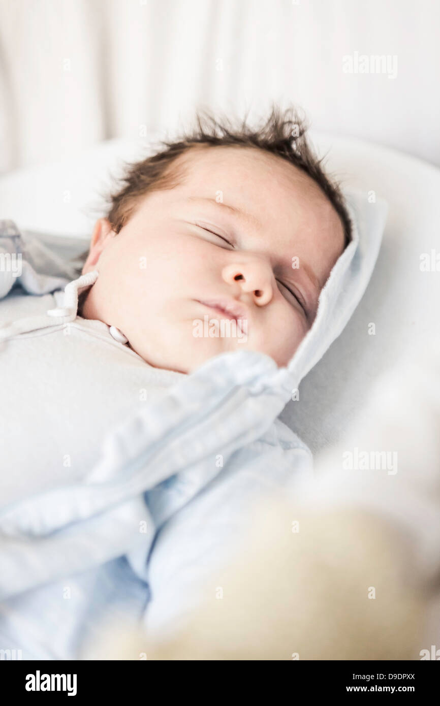 Baby boy sleeping on cot hi-res stock photography and images - Alamy