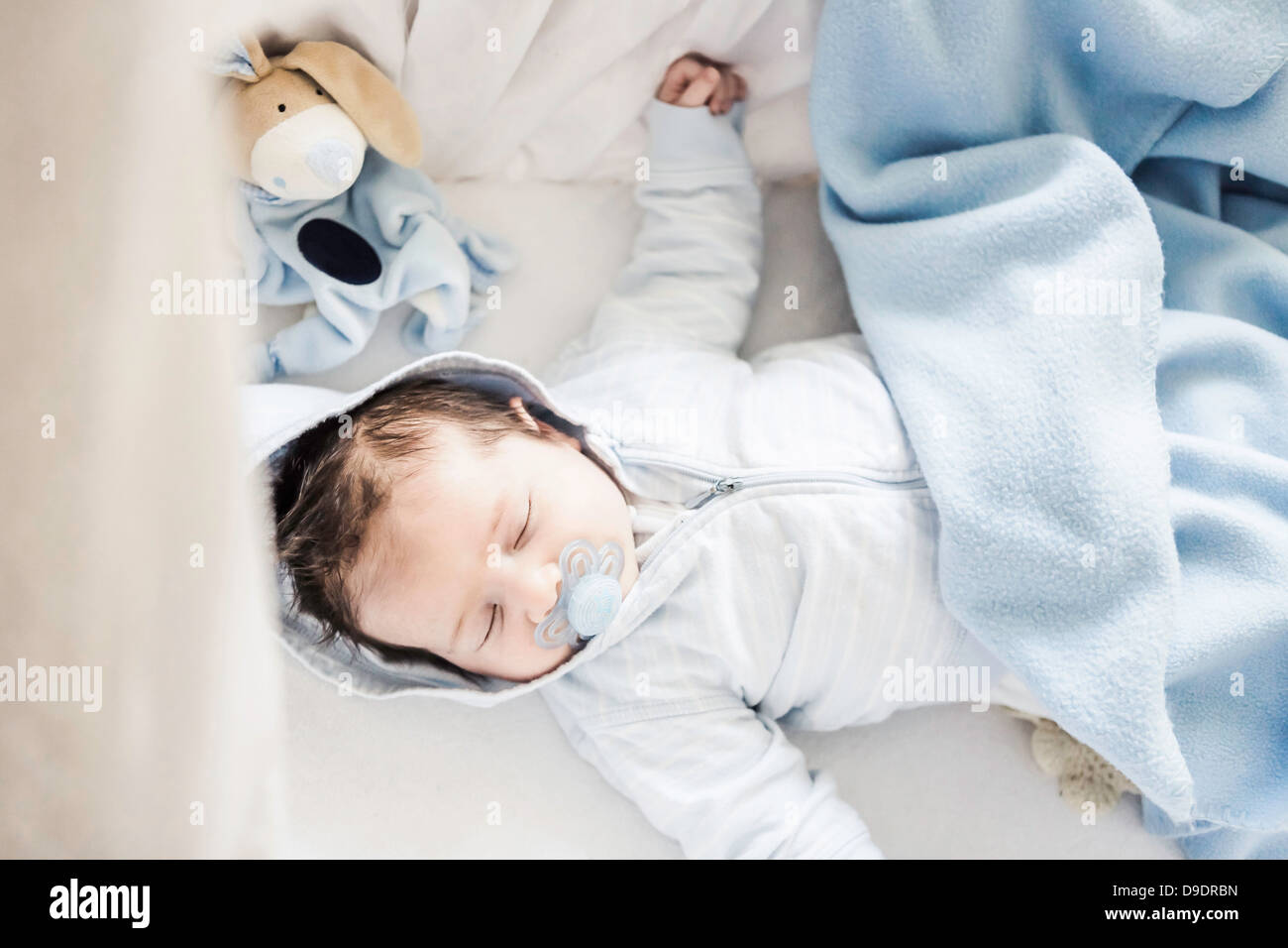 Baby boy sleeping on cot hi-res stock photography and images - Alamy