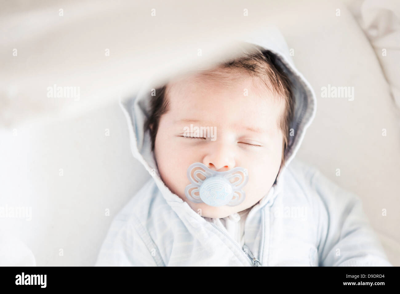 Baby boy sleeping on cot Stock Photo Alamy