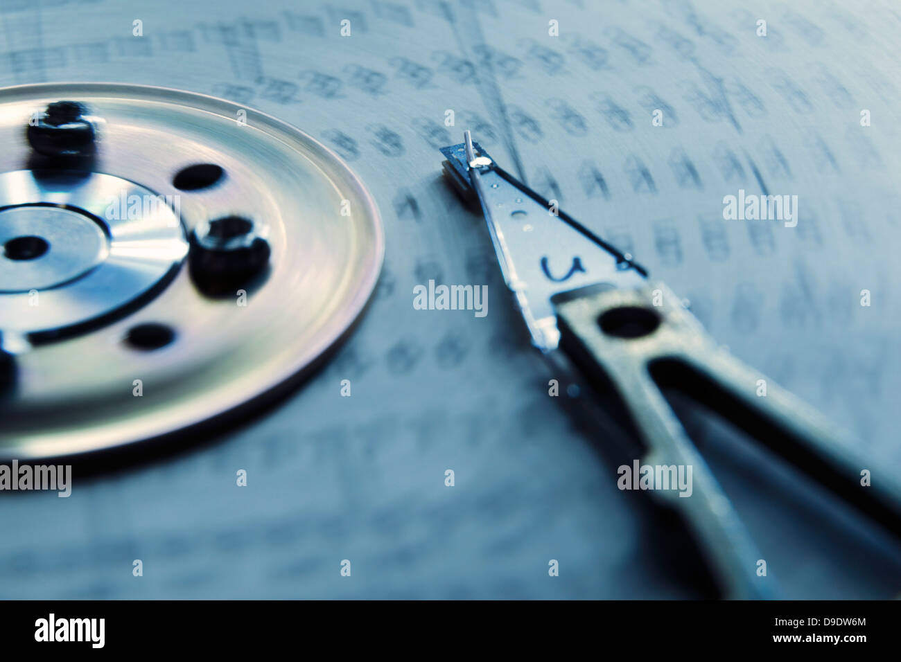 concept image of HDD made from vintage paperboard programming cards with focus on HDD head with disk motion blur Stock Photo