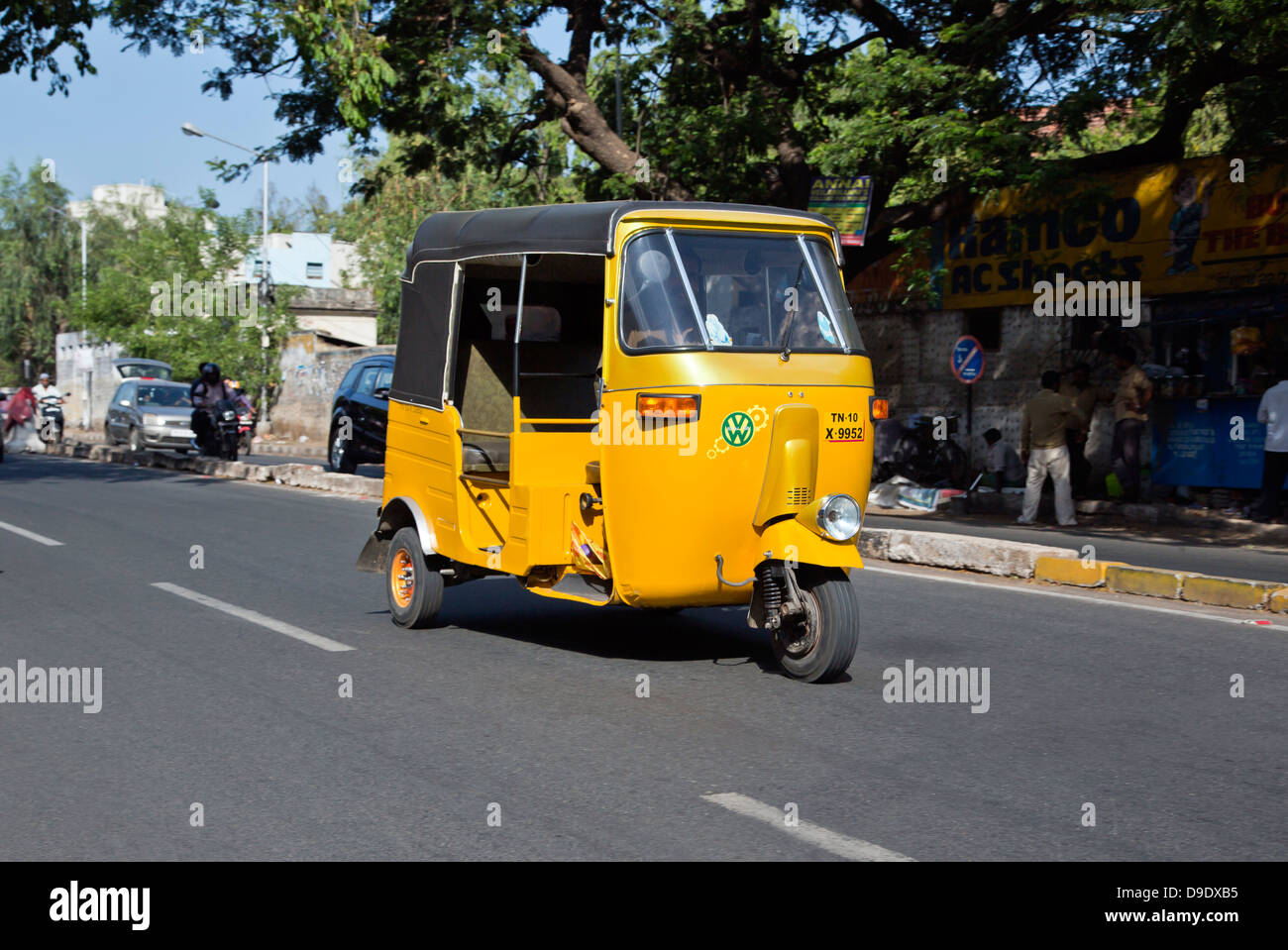 Auto rickshaw moving on the road, Chennai, Tamil Nadu, India Stock Photo